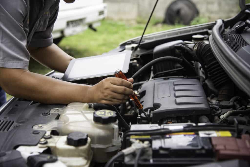 27214858 professional mechanic checking car engine search for data with t